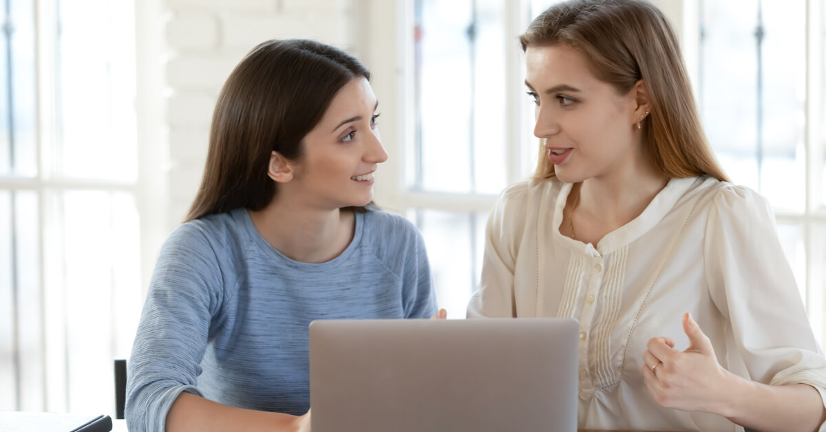 two-women-discussing-work